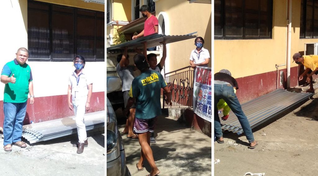 Dr. Ronald Madera (leftmost), Sagip Kapamilya’s partner leading the relief operations for Southern Leyte, received 100 roofing sheets thru LGBU Accounting Assistant Nestor Almaden