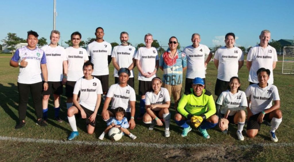 Standing, L-R: PUFC Founder Seven Gadian, Tony Di Rosa, Einstein Chiu, Nigel Jackson, Lucas Blanco, Clive Payne, Strategic Business Planning Head Macky de Lima, Richard Wilson, Kristoff Flores, and Malcolm Lorimer; Seated, L-R: Von Lojo, Mark Clareza with daughter Mira, Kyra Dimaandal, Tonito Payumo, Ana Ordiales, and Justin Guinto 