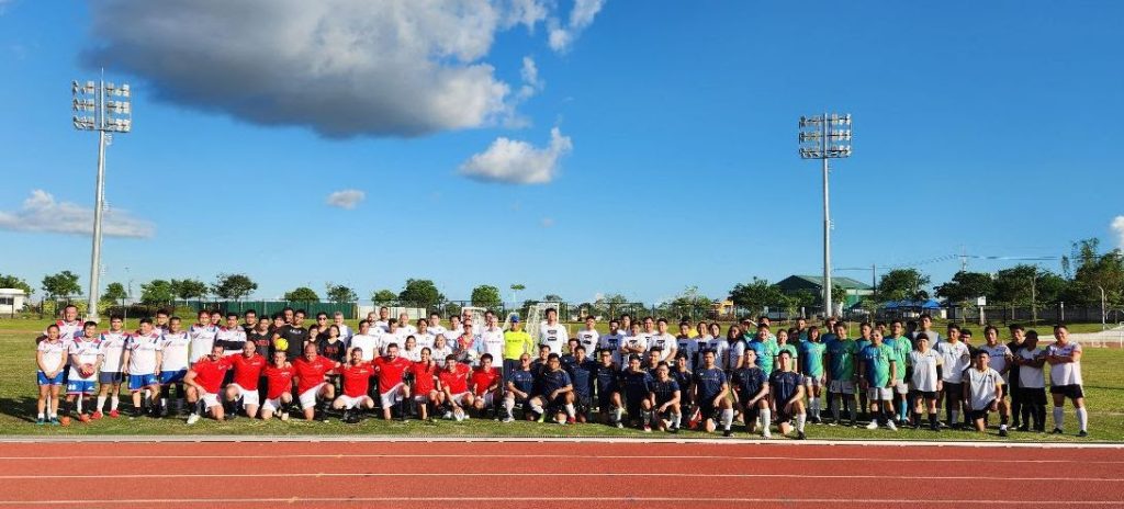 Teams pose for a group photo before the start of eliminations (Standing, L-R) Cemex Football, ARUP FC, First Balfour FC, GHD FC, Holcim Ecoplanet, MDC FC, (Seated, L-R) Acciona FC, and Rockwell FC