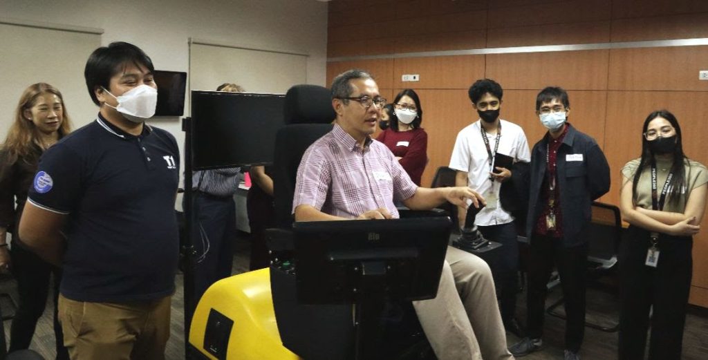 In the photo is Monde Nissin Manufacturing Services Head Rodelito Manalo trying out one of the three ACREOS simulators.